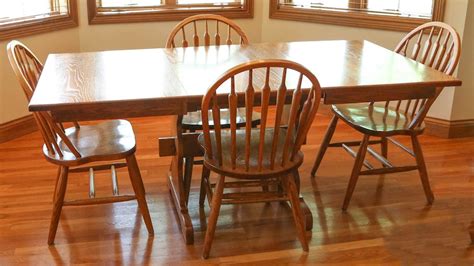 Amish-Made Oak Dining Table and Chairs with Two Leaves | EBTH