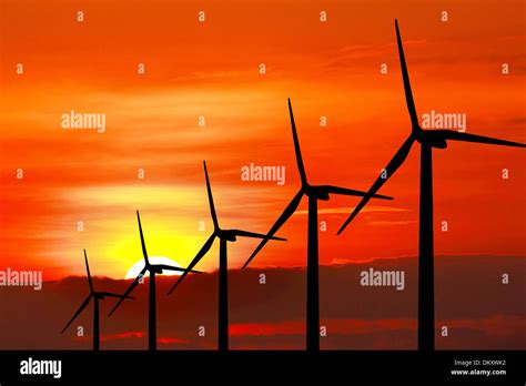 Wind turbine silhouette on sunset background Stock Photo - Alamy