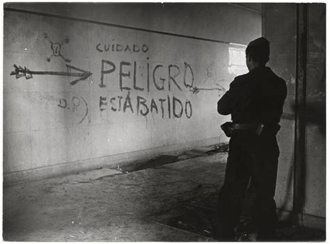 [Republican soldier looking at "danger" graffiti, University City, Madrid] | International ...