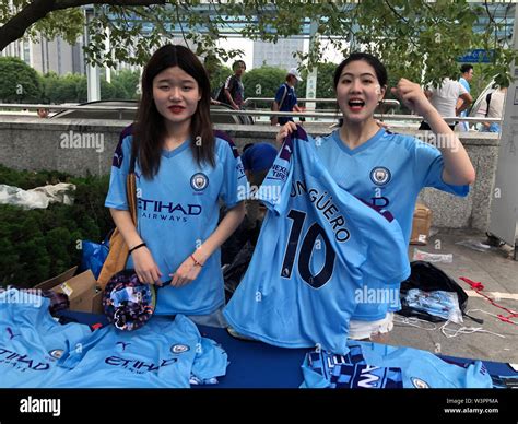 Manchester City fans at the fanzone near the Nanjing Olympic Sports Centre, venue for today's ...