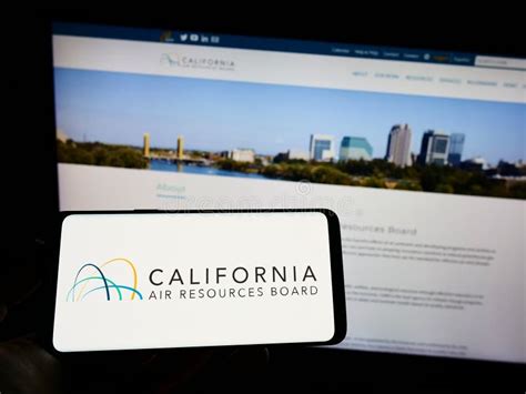 Person Holding Cellphone with Logo of California Air Resources Board ...