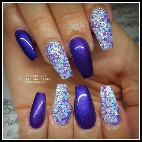 No photo description available. | Purple glitter nails, Purple acrylic nails, Nails