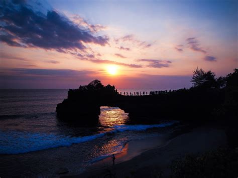 Perfect Sunset with Silhouette of Temple on Tanah Lot Sea