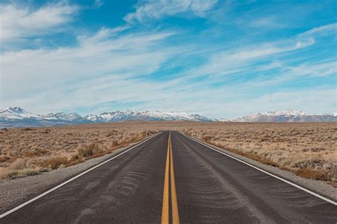 Long road into the mountains photo by Bruno Bergher (@bbergher) on Unsplash