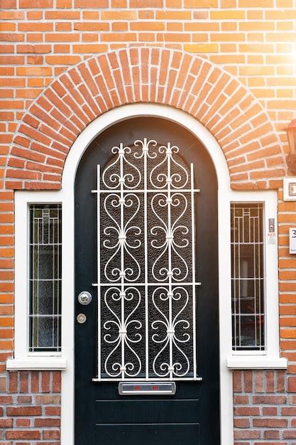 Premium Photo | Wooden front door of a home Front view of a wooden ...