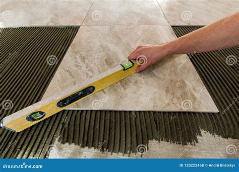 Ceramic Tiles and Tools for Tiler. Floor Tiles Installation Stock Photo - Image of construction ...