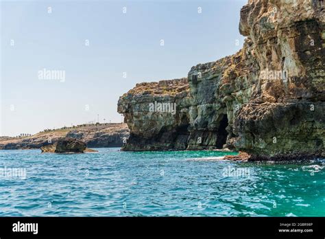 Polignano a Mare seen from the sea. Cliffs and caves Stock Photo - Alamy