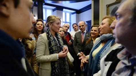 Montreal MP Melanie Joly greets refugees, fields complaints | CTV News