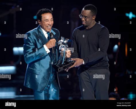 Sean “Diddy” Combs, right, presents the lifetime achievement award to ...