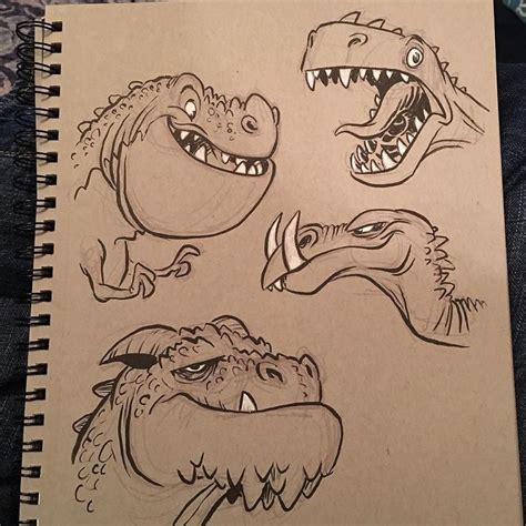 some drawings of dinosaurs on a piece of paper