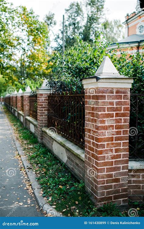 Classical Design Black Wrought Iron Gate in a Beautiful Green Garden ...