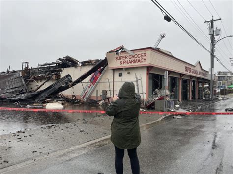 Rain-soaked Steveston community mourns grocery store lost to fire - BC ...