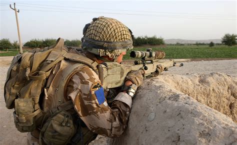 A Paratrooper with 2 Para's Sniper Platoon armed with a L115A3 long ...