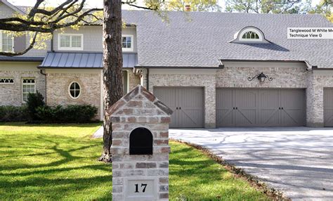 Beautiful color of garage door with the brick | House in the woods, House exterior, Farmhouse house