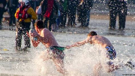 Hundreds brave boxing day dips in North East - BBC News