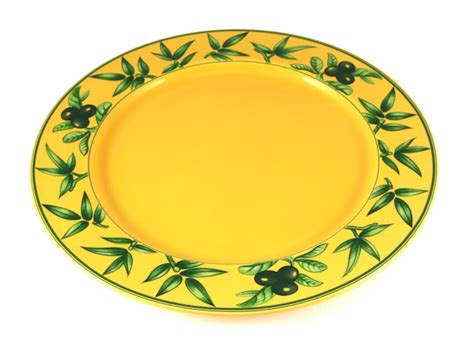 Premium Photo | Yellow decorated empty plate isolated on white