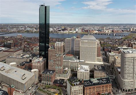 Aerial view of Boston, Massachusetts, with a focus on one of its iconic skyscrapers: the (shiny ...