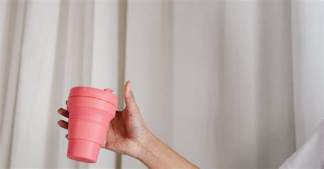 Person Holding Pink Plastic Cup · Free Stock Photo