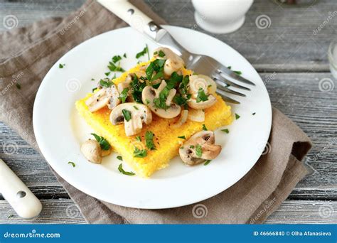 Nutritional Polenta in a Plate on the Boards Stock Photo - Image of ...