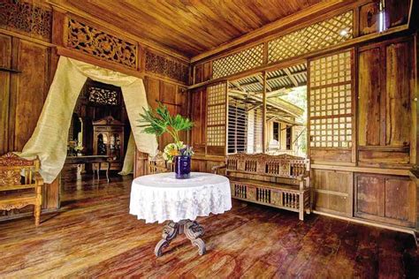 OLD wood, capiz windows, callado tracery are showcased in the parlor ...