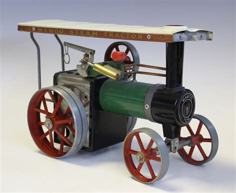 A Mamod TE1a live steam traction engine and three boxed accessories, comprising line shaft, miniatur