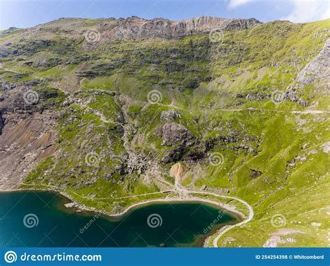 Aerial View of the Shoreline of a Beautiful Mountain Lake Surrounded by ...