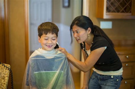 Mother Cutting Son’s Hair