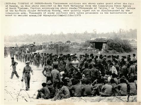 Da Nang 1975 - South Vietnamese soldiers shown under guard in a secured ...