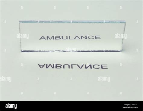 ambulance reflected in mirror shows lateral inversion Stock Photo - Alamy