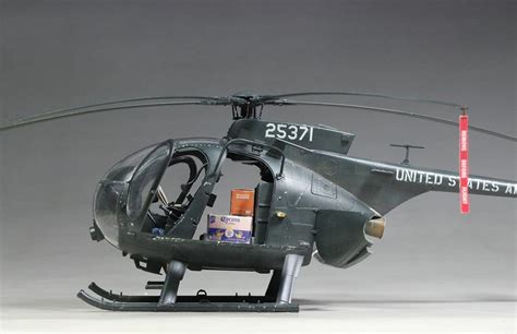 a model helicopter is shown on a gray background