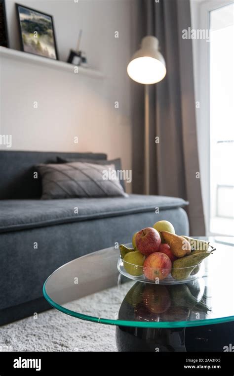 Sofa and glass table in modern living room Stock Photo - Alamy