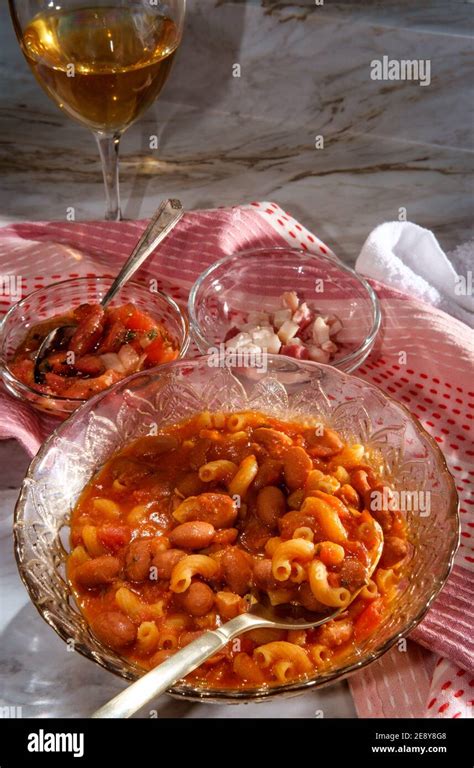 Traditional Italian peasant bean soup pasta e fagioli with elbow macaroni noodles served with ...