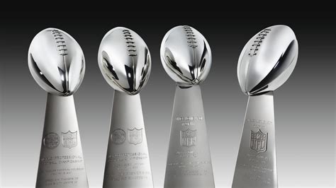 To date, there have been 4 versions of the Vince Lombardi Trophy. While no team owns all 4, the ...