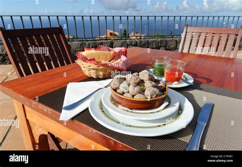 Traditional Canarian cuisine, Canarian wrinkly potatoes, Papas Arrugadas with Rojo Mojo and Mojo ...