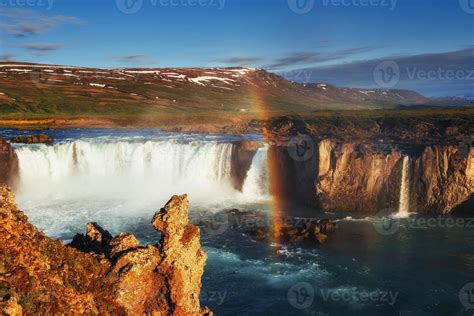 Godafoss waterfall at sunset. Fantastic rainbow. Iceland, Europe ...