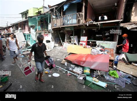 Caloocan City, Philippines. 26th May, 2015. Residents evacuate with ...