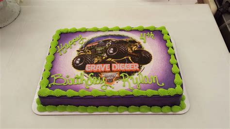 a birthday cake with an image of a monster truck on it