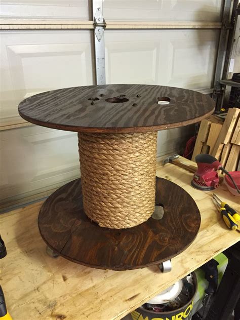 Spool table stained, wrapped in natural rope, and industrial casters ...