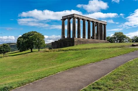 Premium Photo | Monuments on calton hill overlooking the city of ...