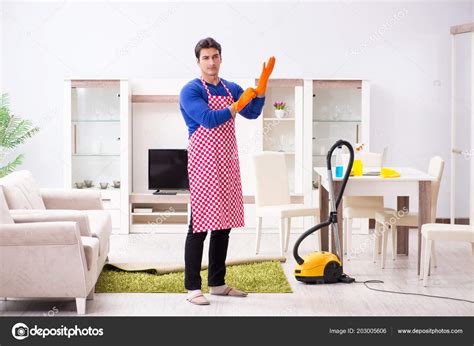 Contractor man cleaning house doing chores — Stock Photo © Elnur_ #203005606
