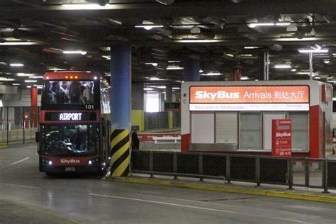 Passengers depart SkyBus double decker #101 BS01LS on arrival at the Southern Cross coach ...