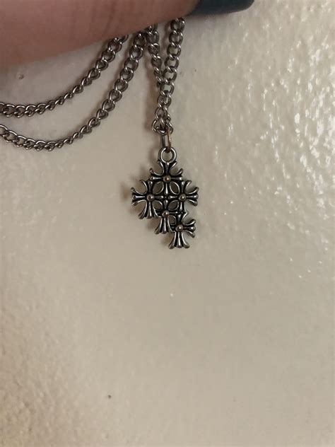 This symbol on a necklace. Found at a Catholic store that sources its stock from local thrift ...