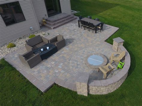 Gray Paver Patio with Edging, Rocks, and Plants - Oasis Landscapes