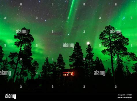 Night sky with Aurora Borealis, planet Jupiter and The Pleiades above country house Stock Photo ...