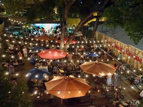 Umbrellas are cool, what is that floor surface? | Beer garden design, Outdoor restaurant design ...