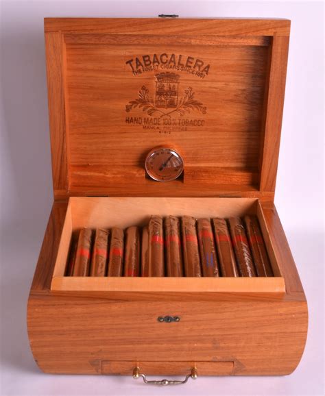 A TABACALERA HUMIDOR containing numerous Manila tabacalera cigars.