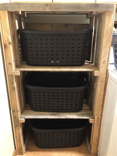 My husband made me a laundry basket storage unit. Love it!! | Laundry ...