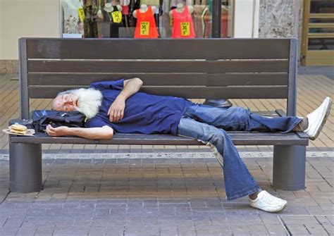 old man is sleeping on a bench outdoor in Sofia, Bulgaria - Stock Image - Everypixel