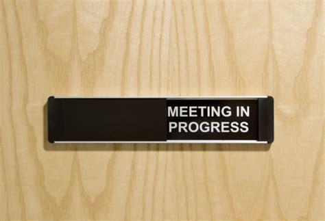 Meeting In Progress Sign On Office Door Stock Photo - Download Image Now - iStock