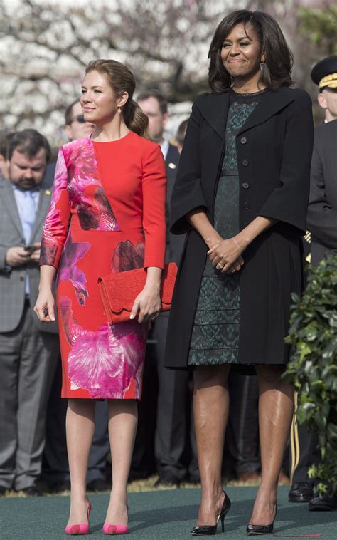 First lady Michelle Obama and Sophie Grégoire-Trudeau, stand together during the arrival ...